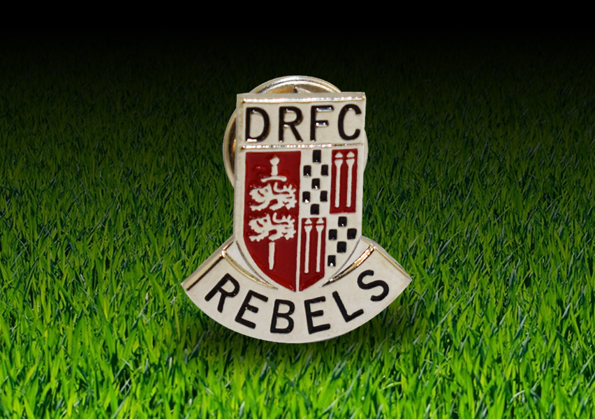 Die stamped, DRFC club pin badge with soft enamel inlay.