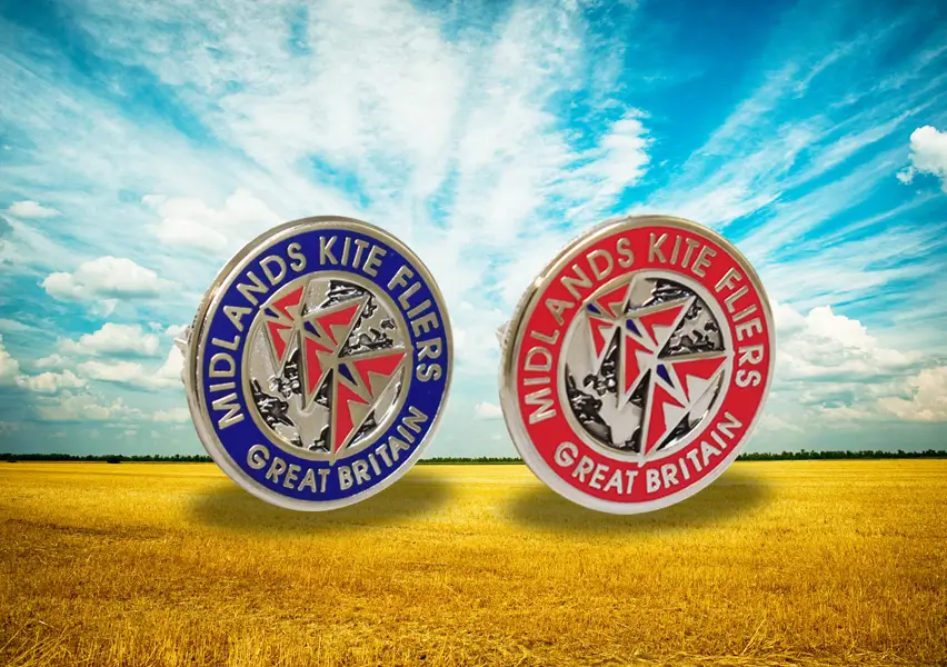 Die stamped, palladium plated enamel badges featuring the Midlands Kite fliers branding logo.