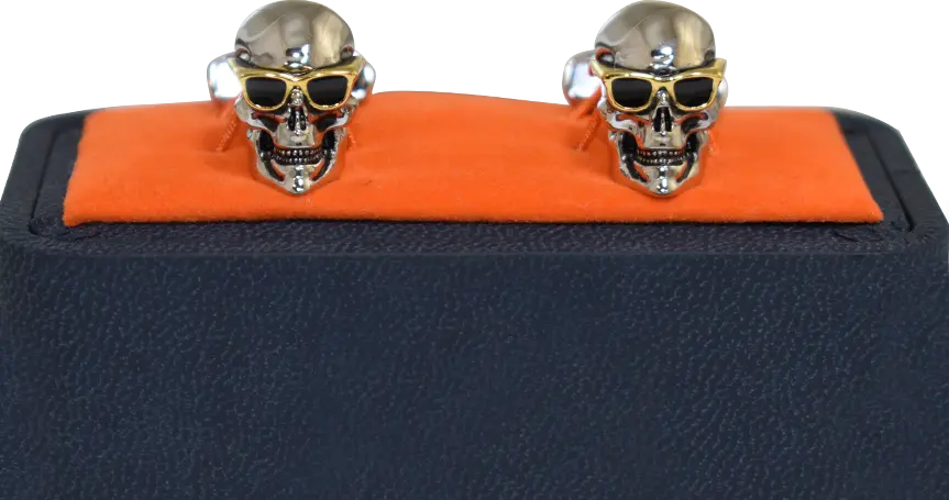 Die cast, silver plated skull cufflinks on a mock leather display box.