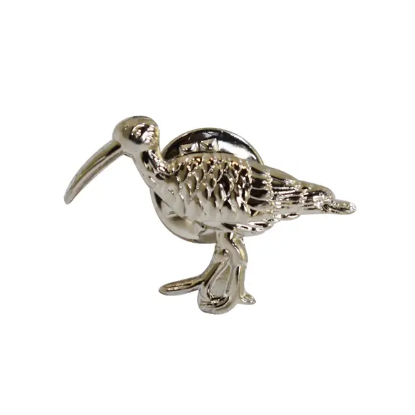 Die stamped, silver-plated 3D Curlew badge.