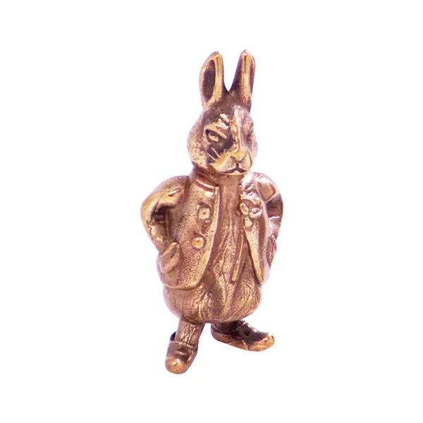 High-Relief Detail antique brass rabbit badge.