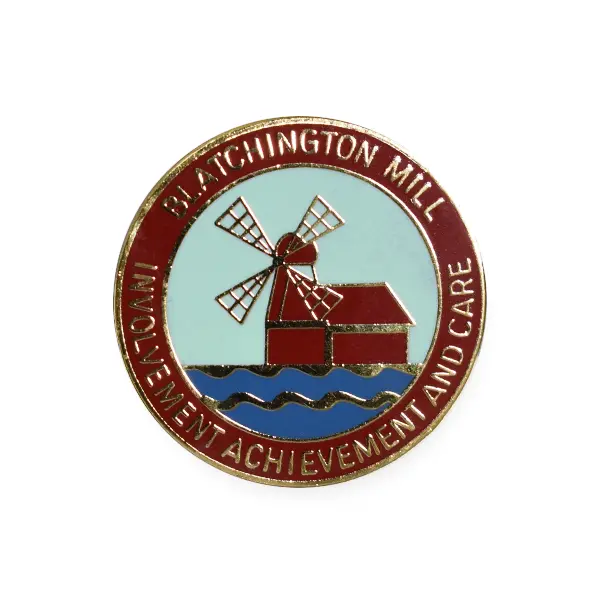 Die stamped, gold-plated badge featuring the Blatchington Mill school crest with enamel inlay.