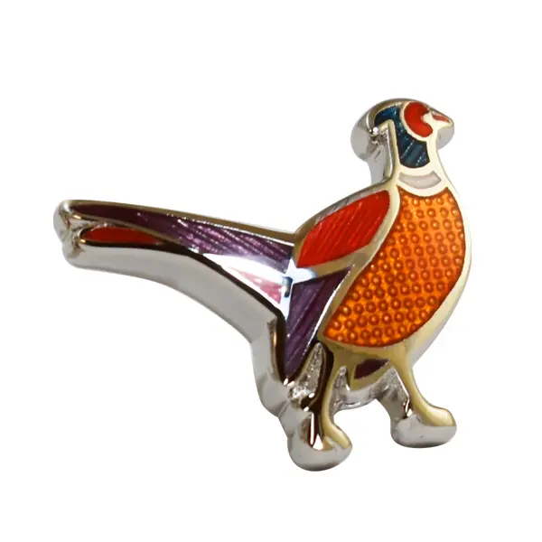 Die stamped, silver plated pheasant badge with trans enamel inlay.