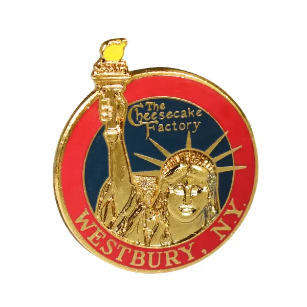 Die stamped, gold plated badge with enamel inlay featuring The Cheesecake Factory logo.