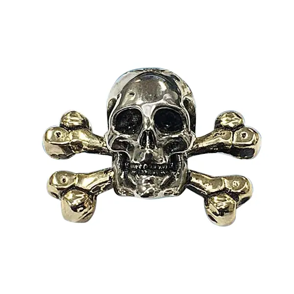 Die cast, silver and gold plated skull and crossbones badge.