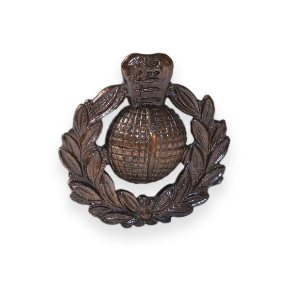 Bronze cap badge antique effect