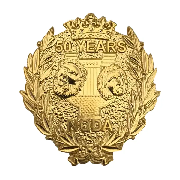 Die stamped, gold-plated badge featuring the NODA logo within a laurel wreath.