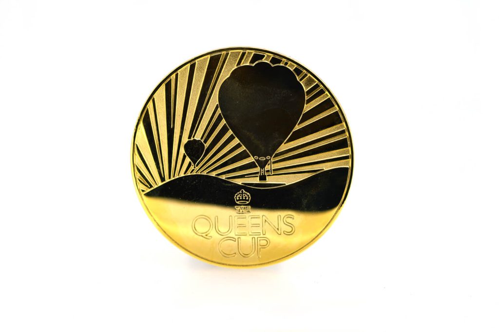 Queens cup medal with gold plated finish.