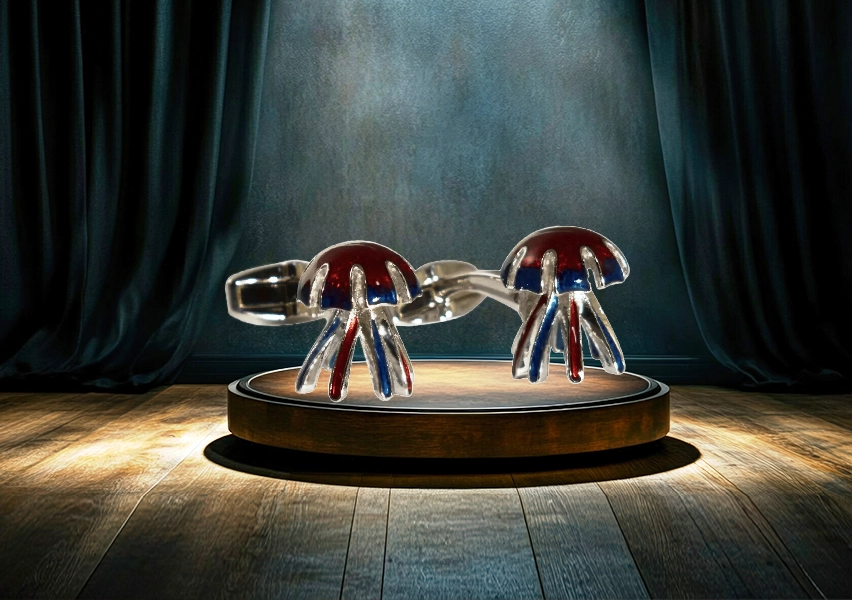 A pair of stylish, hand-polished jellyfish cufflinks with vibrant transparent enamel in a presentation