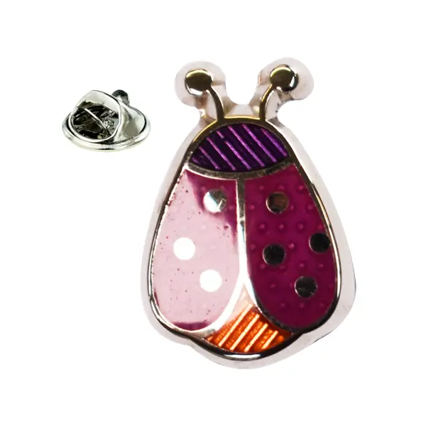 Purple and orange ladybird pin badge