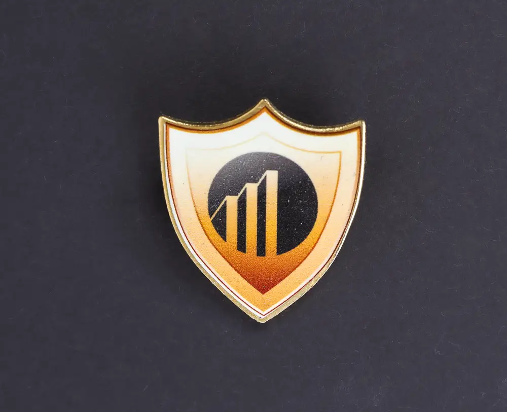 Gold plated badge shield