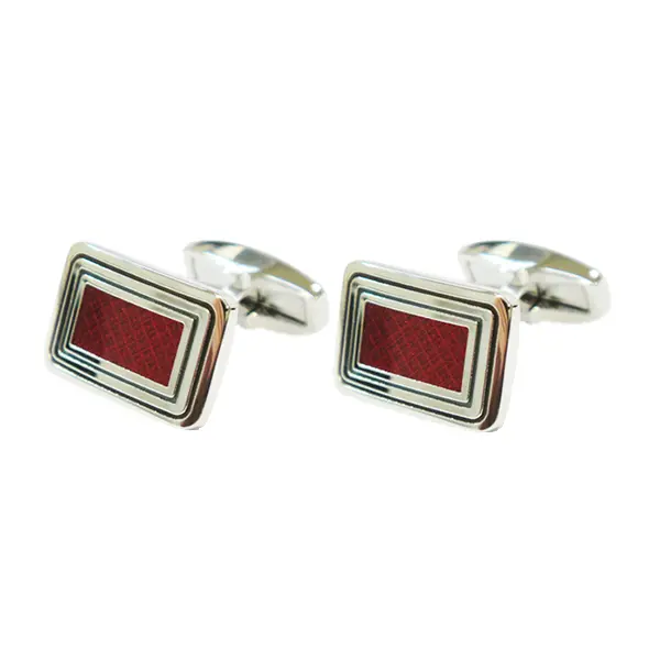 Rectangle red cufflinks with diamond stamping.