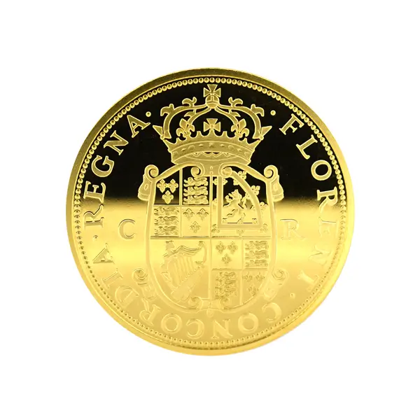 Close-up of a high-detail, gold-plated replica coin, showcasing intricate relief and modern craftsmanship.