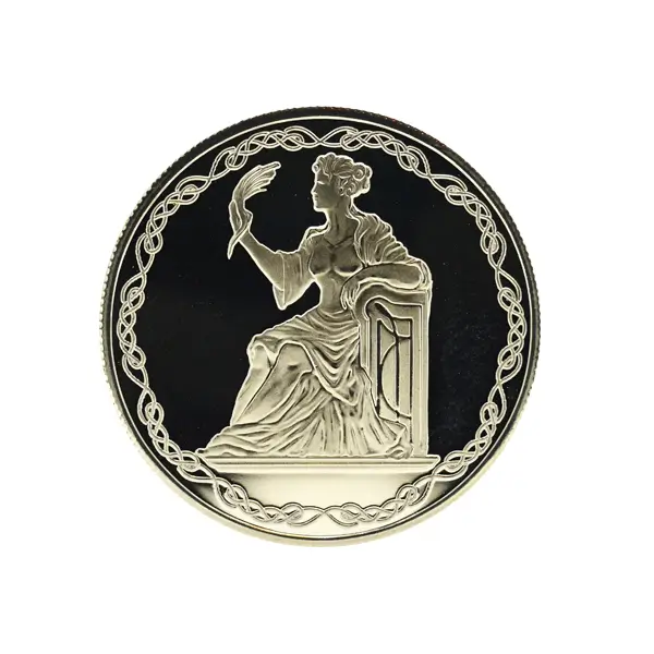Close-up of a custom silver coin featuring a classical woman in raised relief.