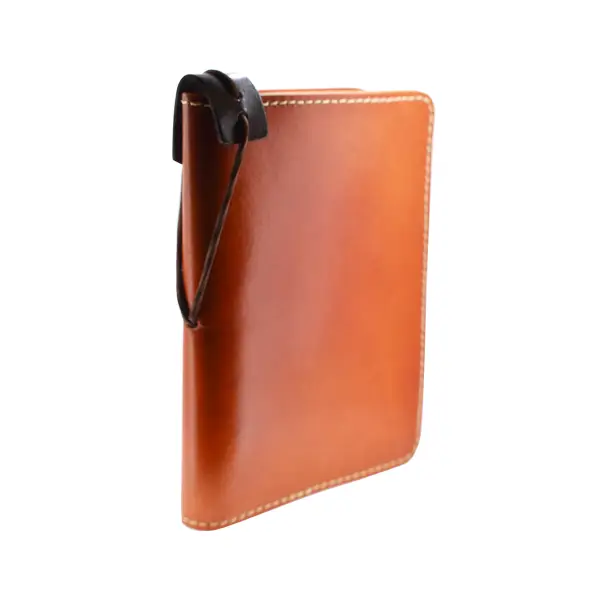 Orange leather bound notebook.